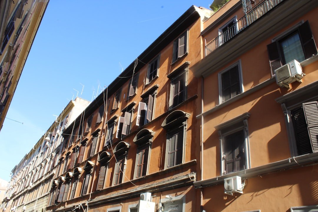 A row of buildings with windows and balconies — EasyCasa Italy