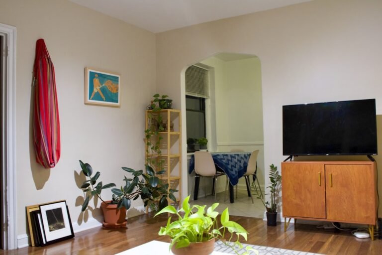 a living room filled with furniture and a flat screen tv