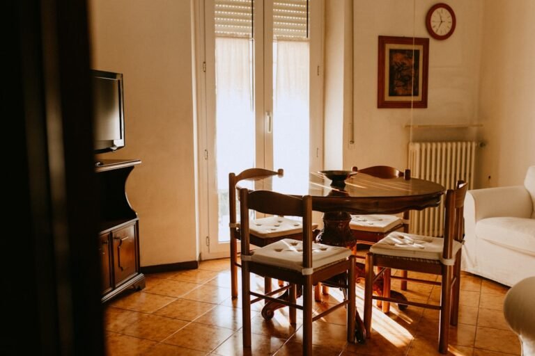 a living room with a table and chairs