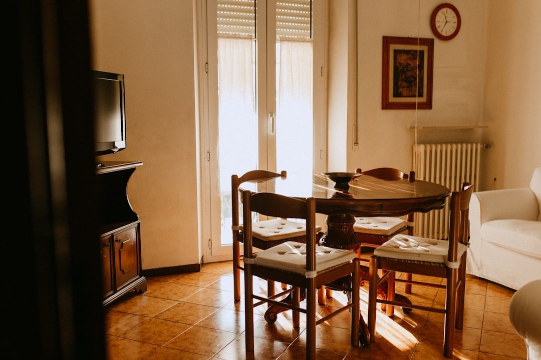 a living room with a table and chairs
