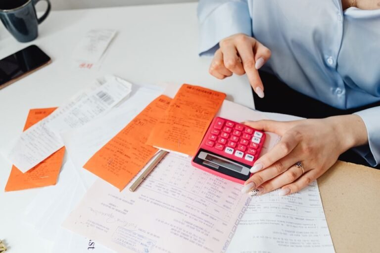 laptop accounting spreadsheet receipts calendar booking management system italian host apartment paperwork rental property