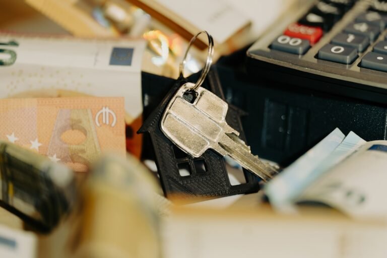 A pile of money sitting next to a calculator